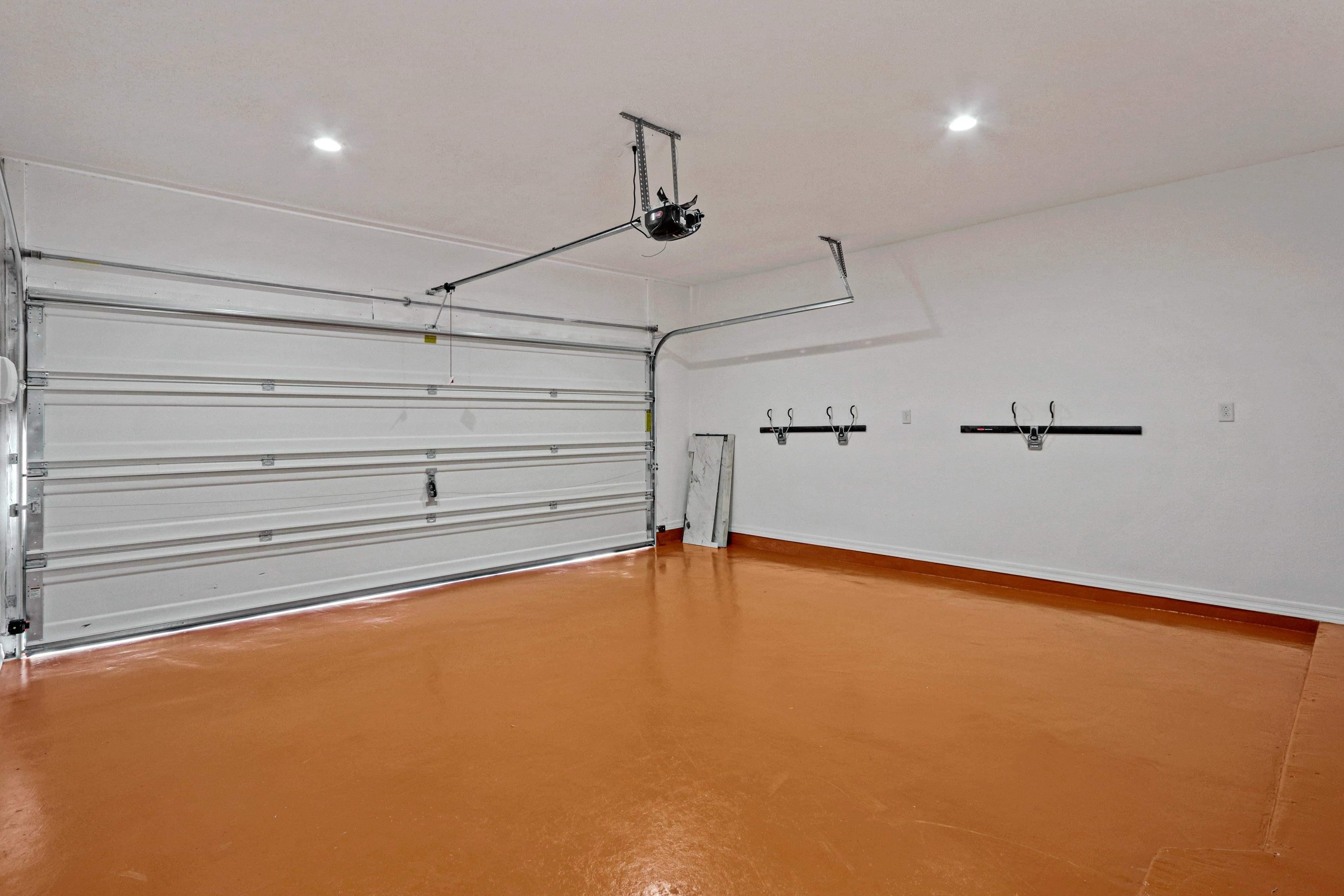 Terracotta epoxy garage floor coating installed in a Socorro, TX garage